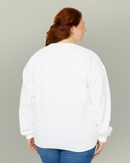 Person wearing a white sweatshirt and blue jeans on a plain background