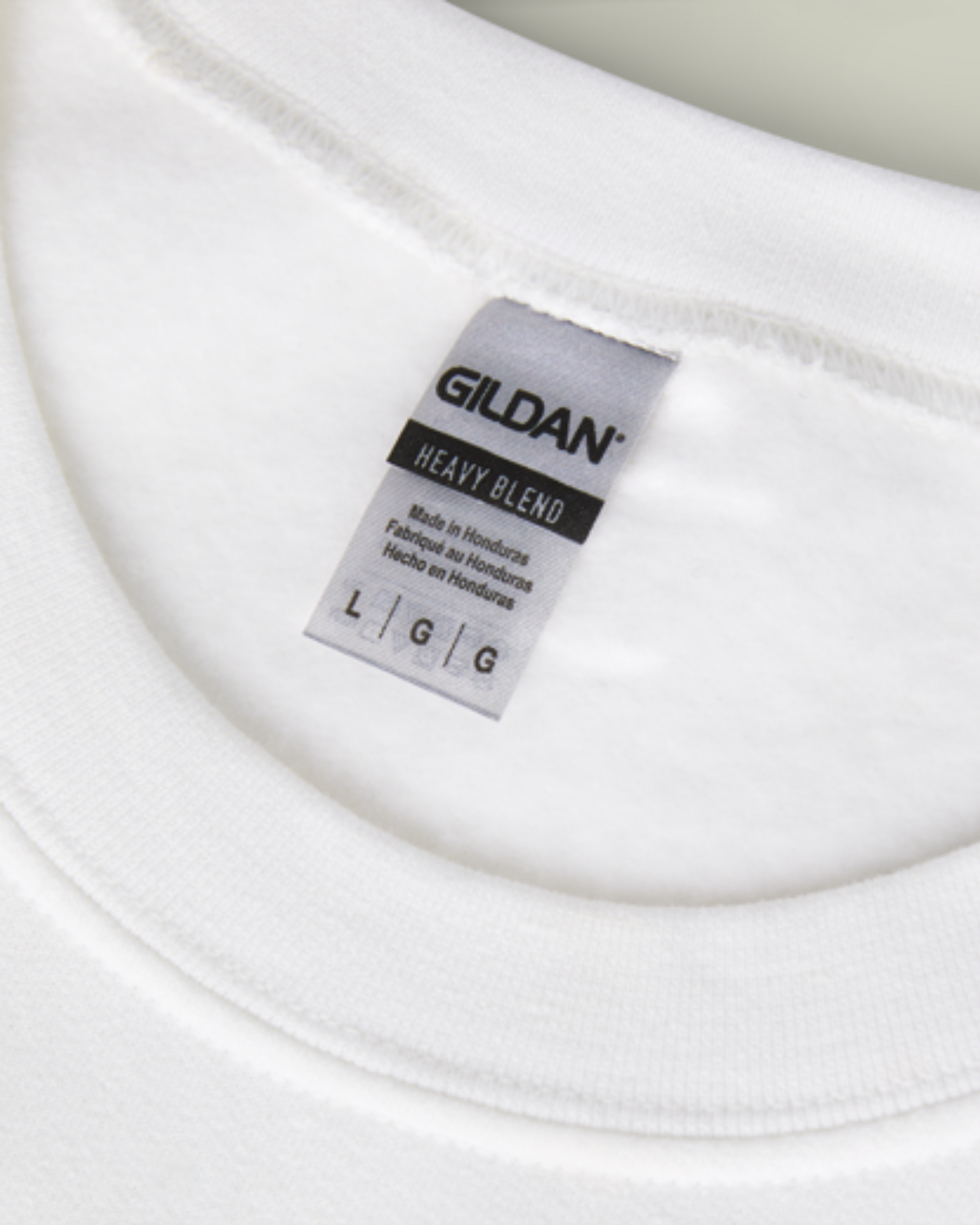 Gildan label on a white t-shirt
