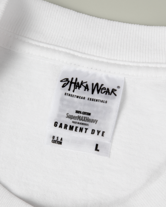 Shaka Wear label on a white garment with black text